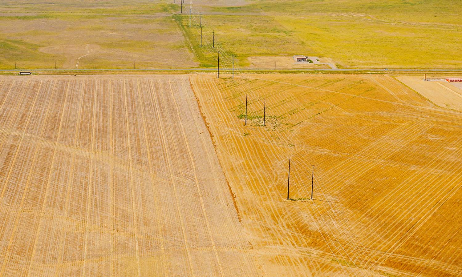 working-farmland-with-transmission-lines-running-through-it